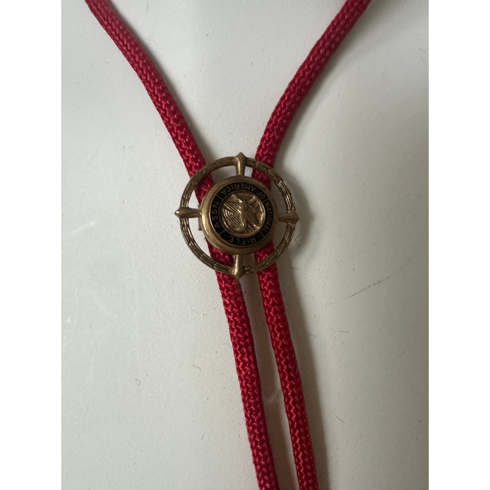 Vintage NRA Bolo Tie Red Cord Rifle Association Medallion Gold Tone